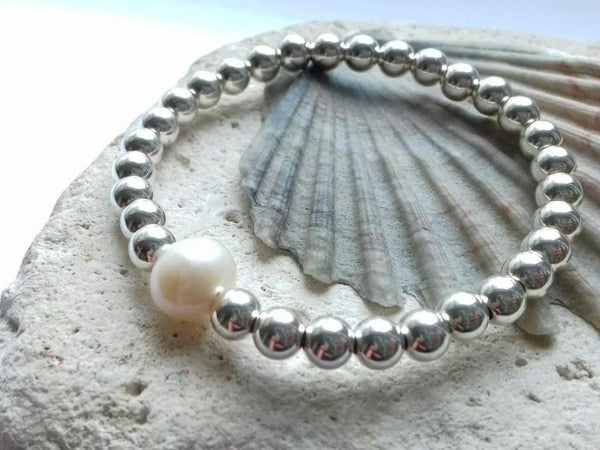 Polished Recycled Silver beaded bracelet with a pearl on a shell