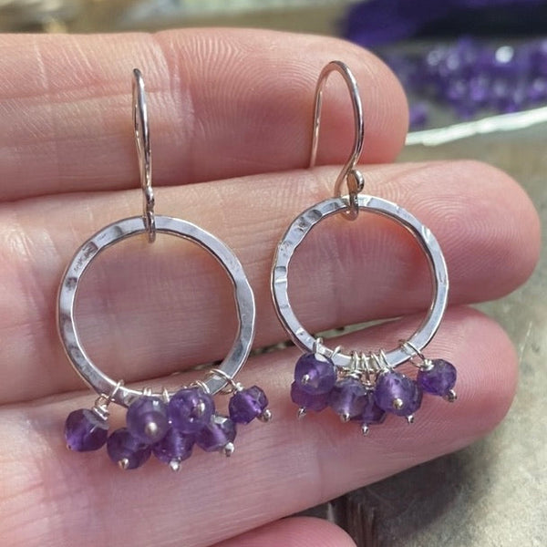 Amethyst disco ruffle earrings, textured silver circles with gemstones hanging in a ruffle