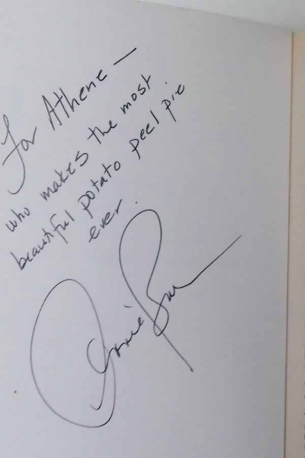 A copy of the Guernsey Literary and Potato Peel Pie Society book, signed by the author Annie Barrows. Annie has written "For Athene - who makes the most beautiful potato peel pie ever. Annie Barrows"