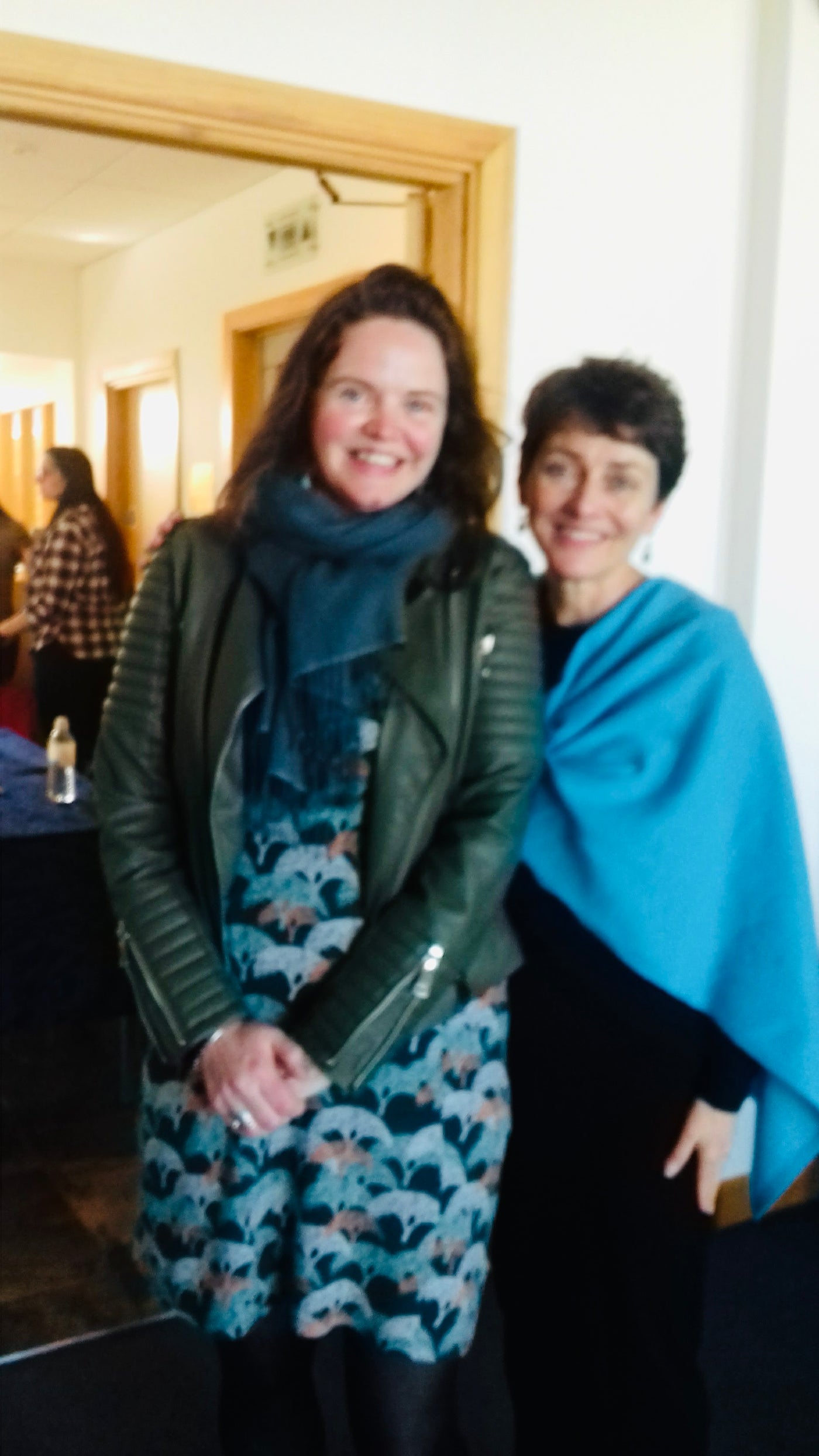 Annie Barrows author and Athene Sholl jeweller standing together indoors at the inaugural Guernsey Literary Festival