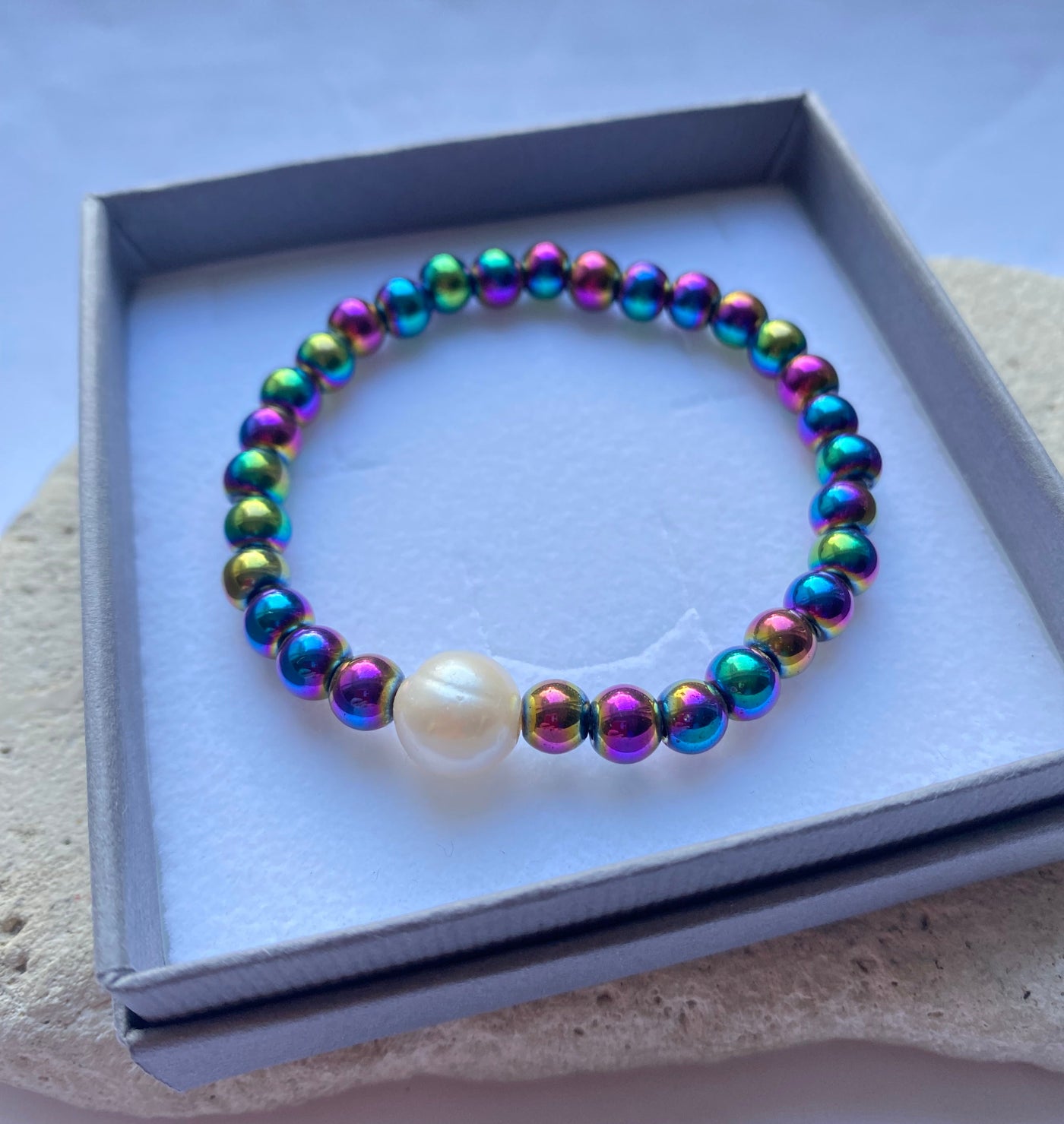 Rainbow hematite bracelet with freshwater pearl in a grey gift box