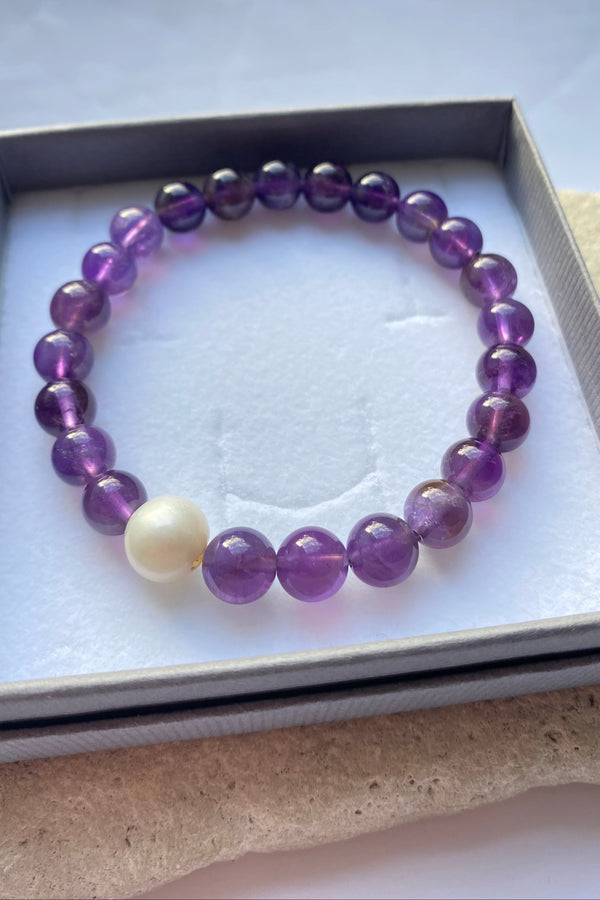 purple amethyst bracelet in a grey gift box