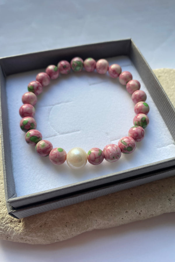 Pink jade bracelet in a grey gift box