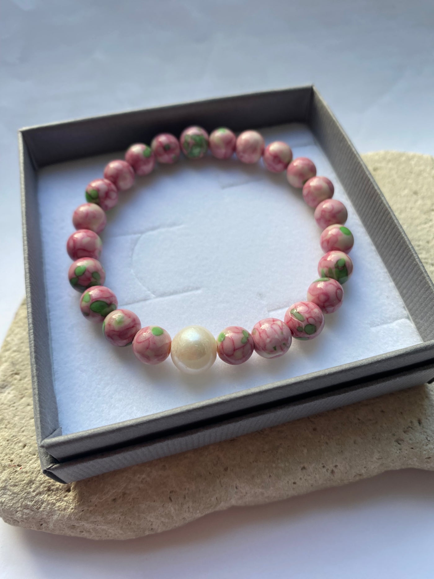 Pink jade bracelet in a grey gift box