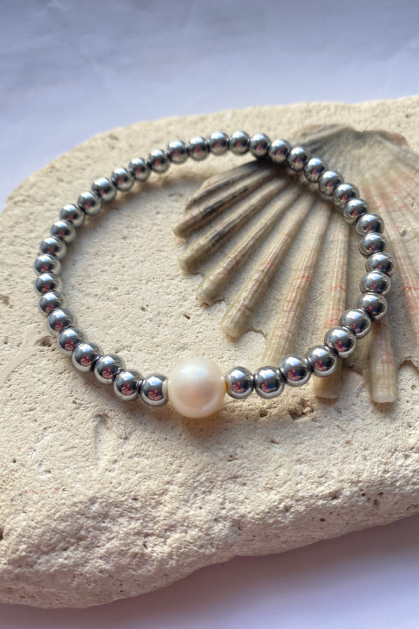 hematite bracelet on a stone background
