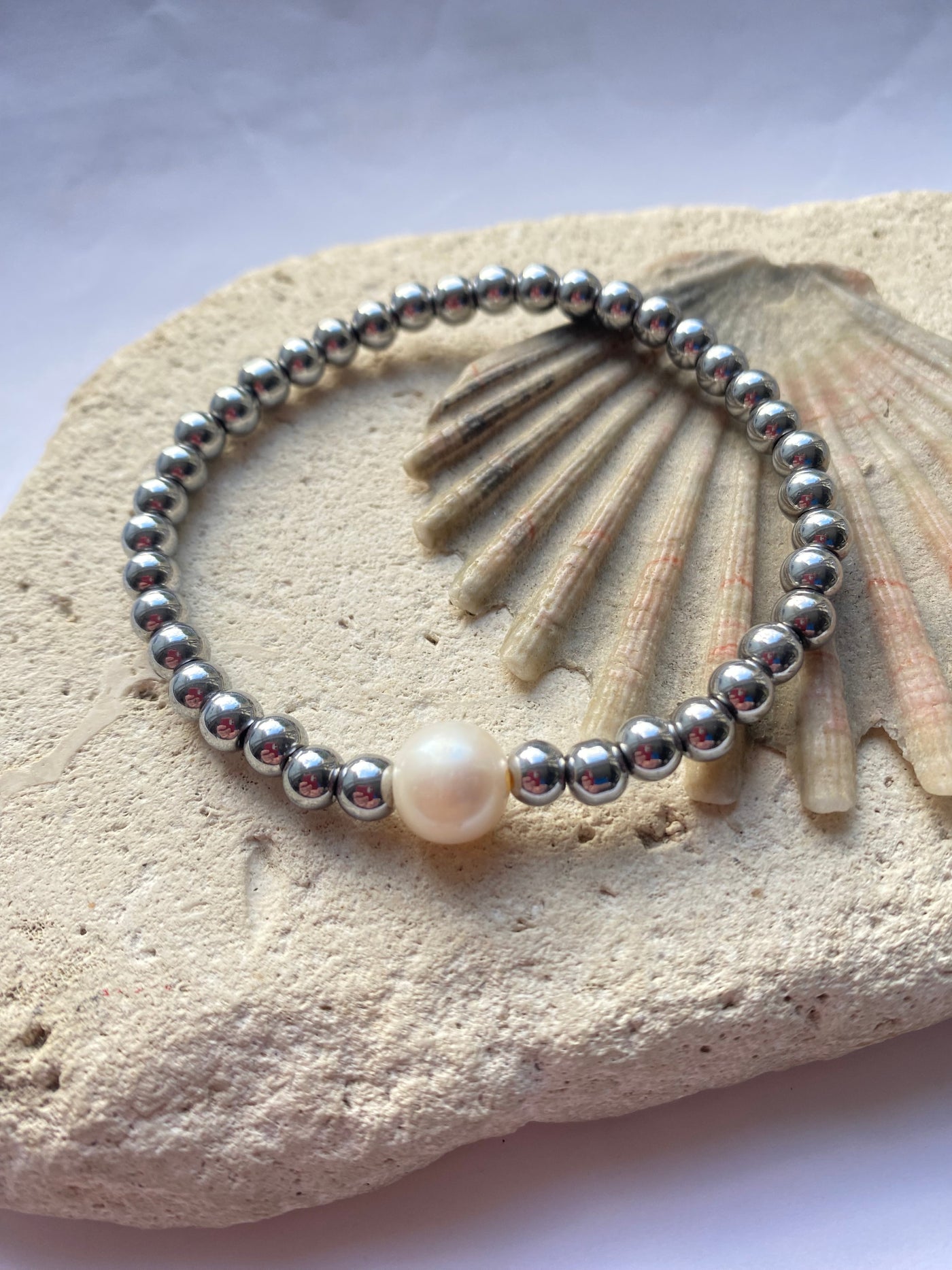 hematite bracelet on a stone background