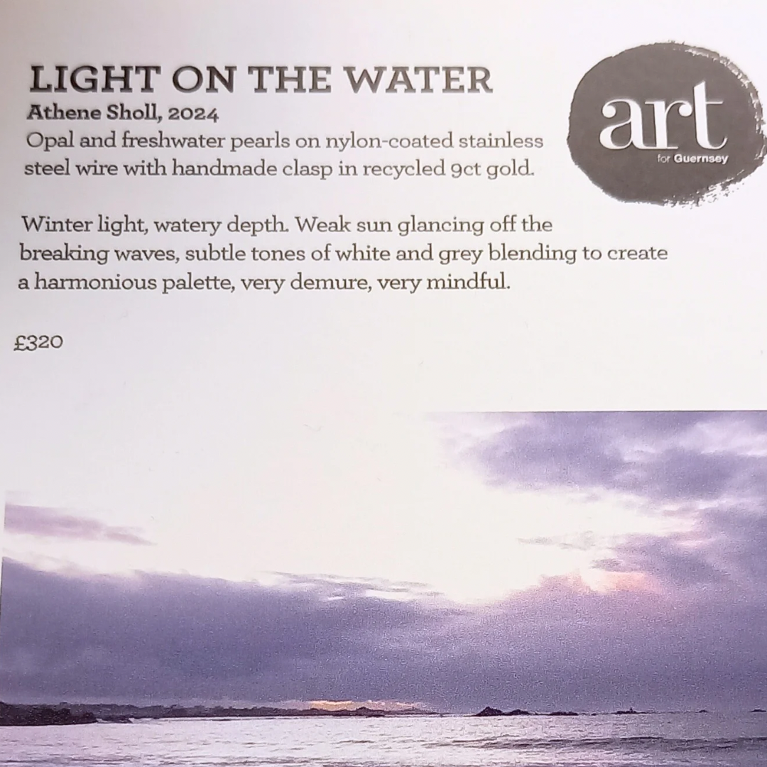 Gallery credit from "Art for Guernsey" exhibition, with details of white opal necklace and the beach scene that inspired it. 