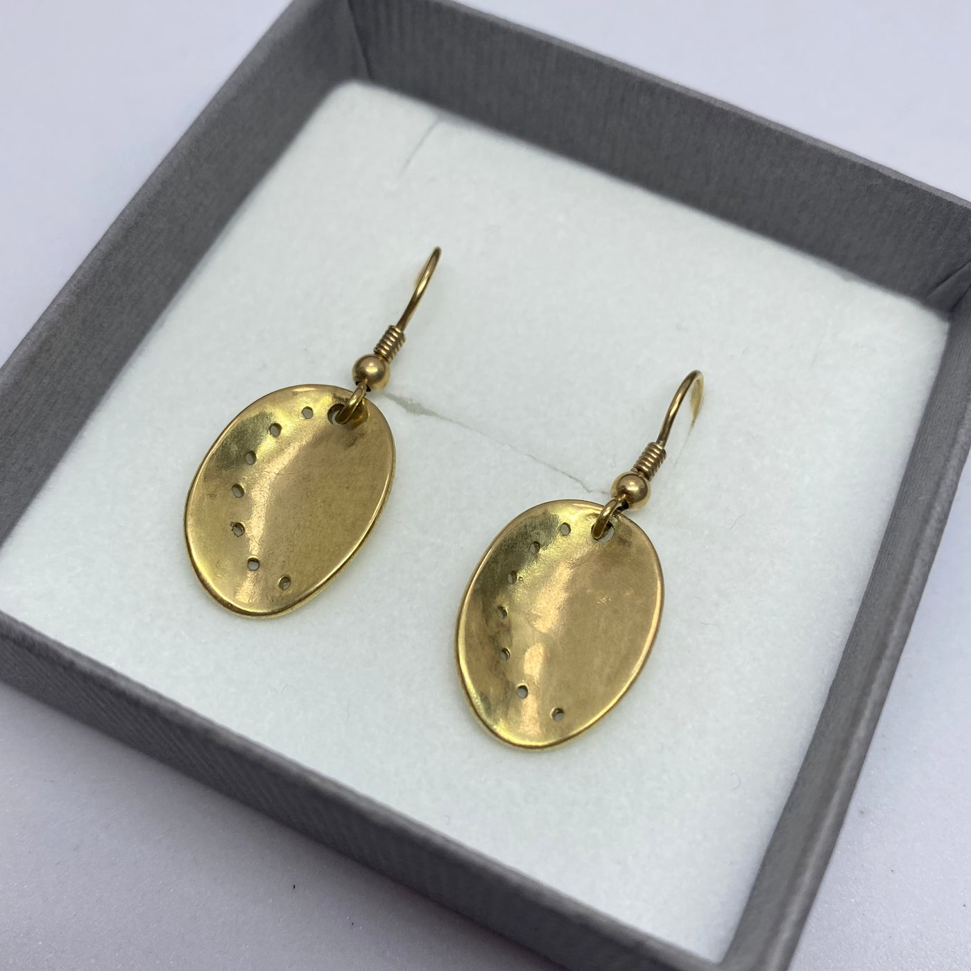 Guernsey ormer shell hook earrings in 9ct yellow gold, displayed in a gift box. 