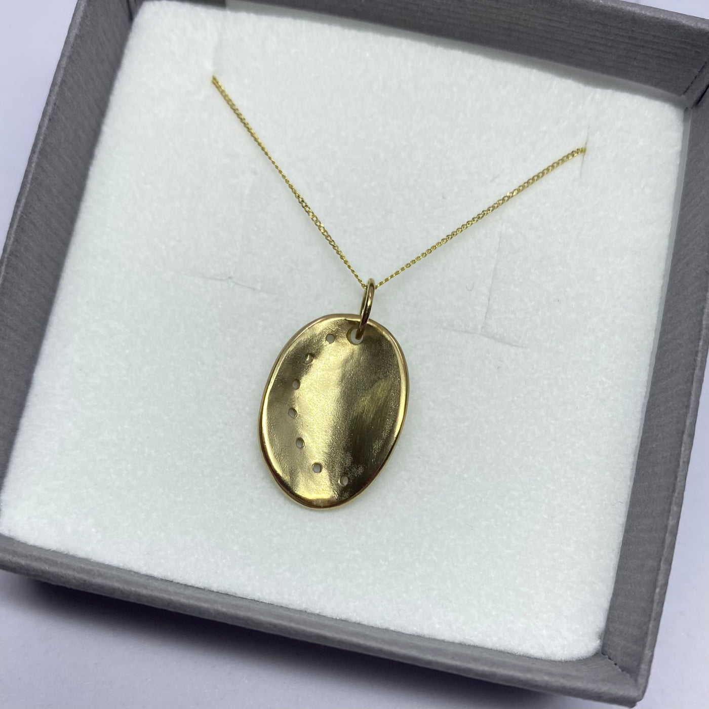 Guernsey ormer shell pendant in 9ct yellow gold on a chain in a gift box. 
