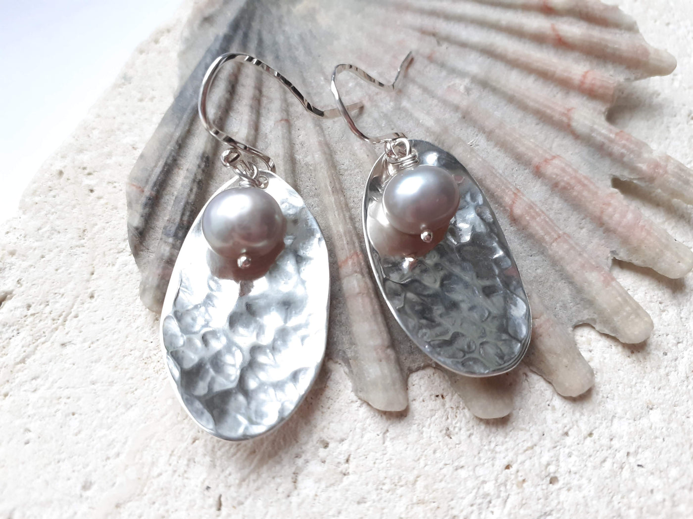 Silver earrings with pearls on a shell background, inspired by the book, "The Guernsey Literary and Potato Peel Pie Society"