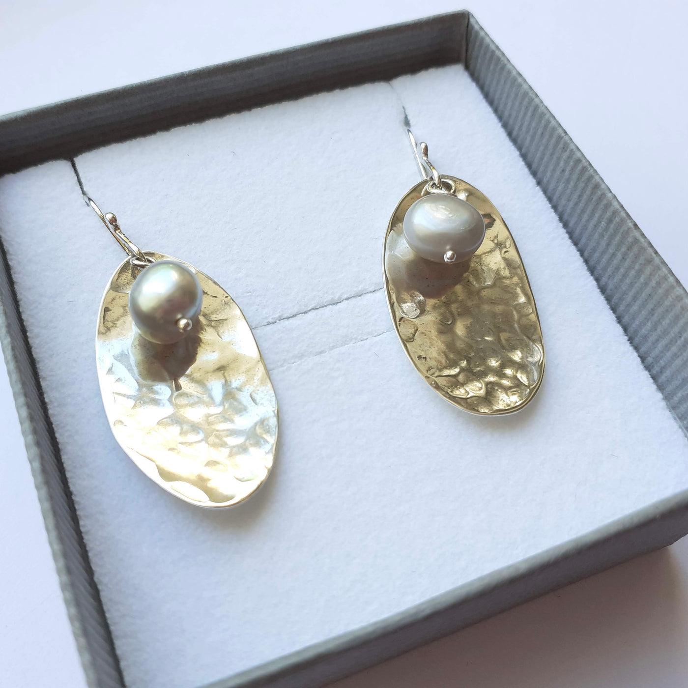 polished silver potato peel earrings with grey freshwater pearls, in a gift box