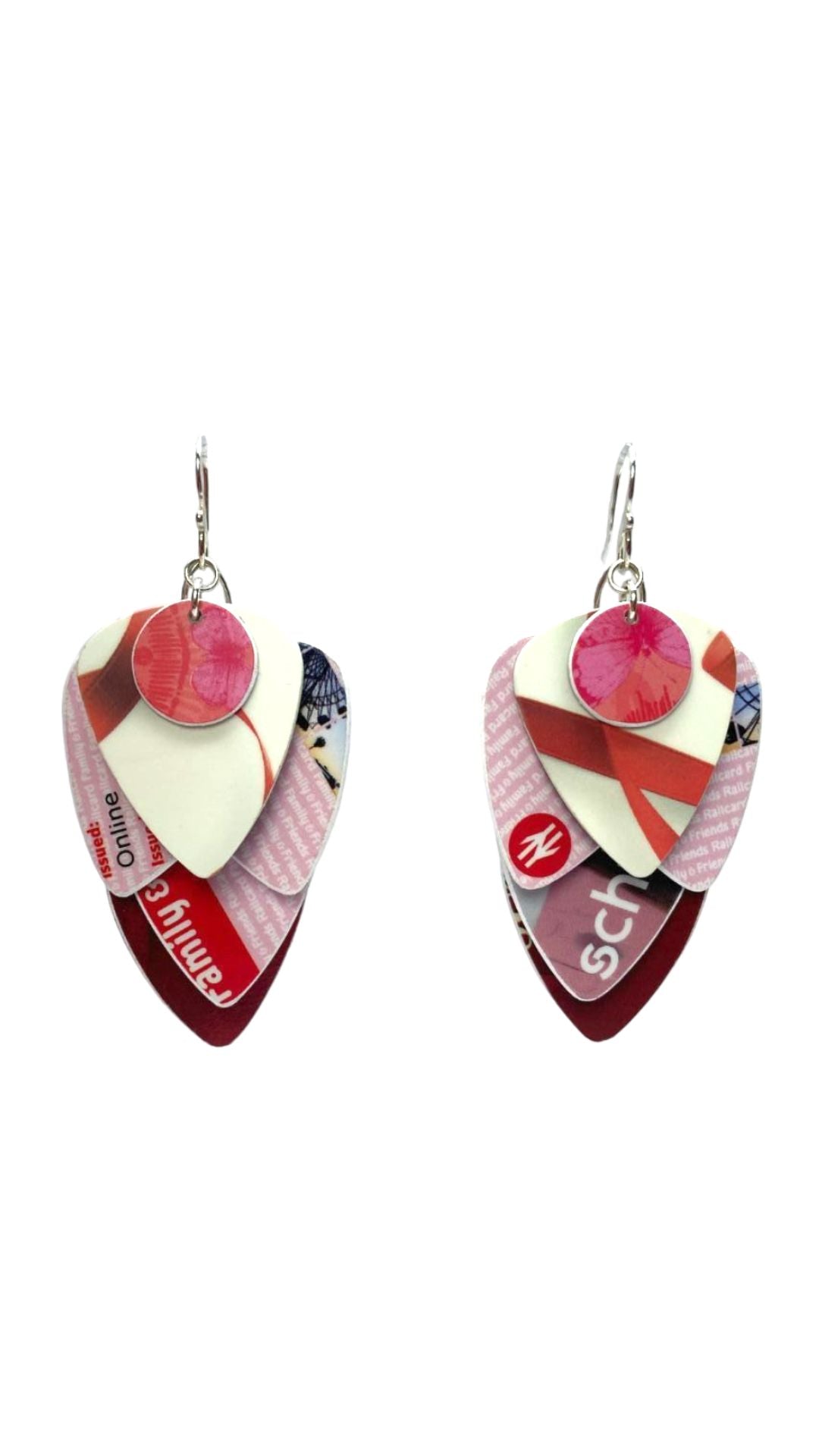 Colorful guitar pick-shaped earrings on a white background