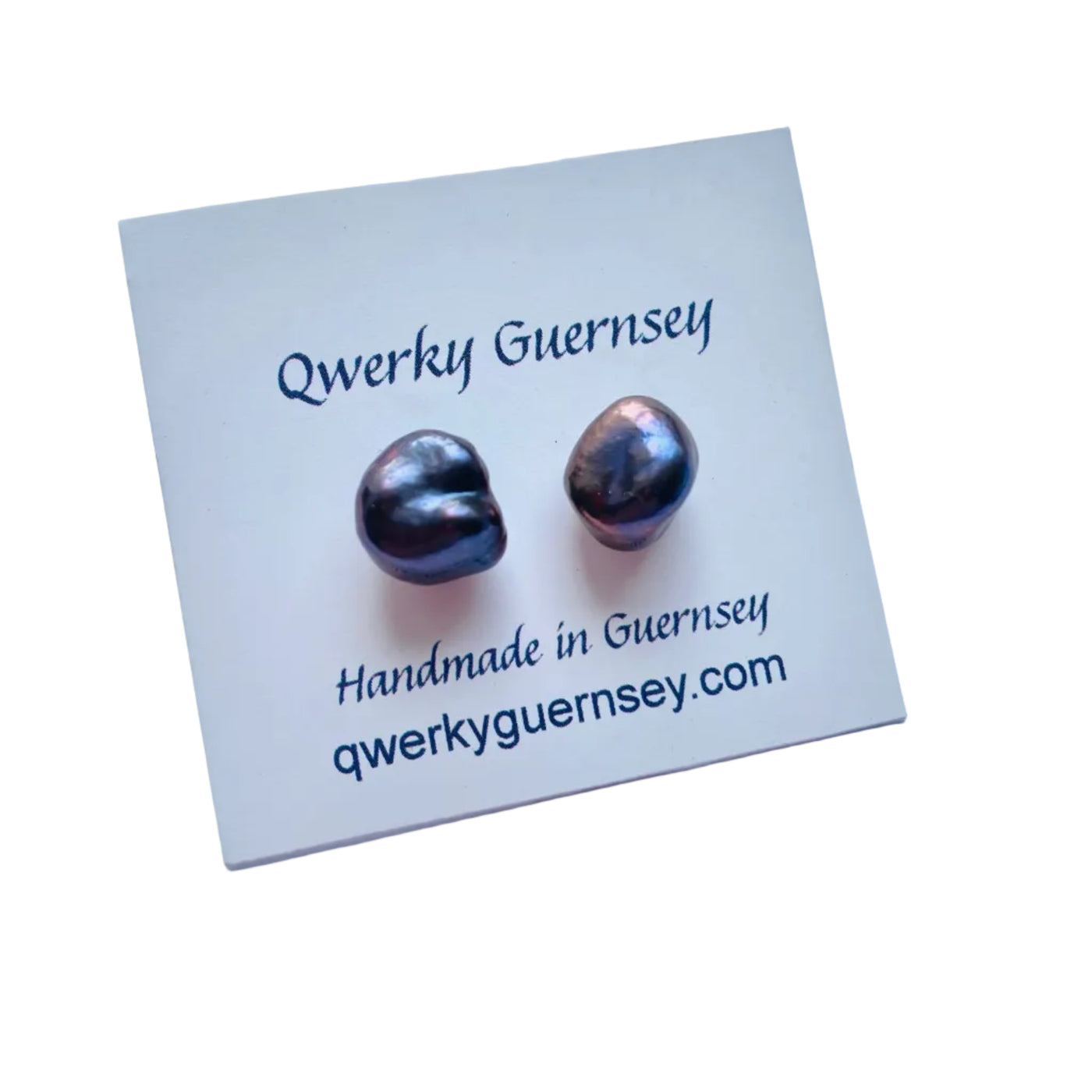 Pair of baroque pearl earrings on a Qwerky Guernsey branded card with a white background