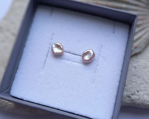 shell pink irregular textured pearl studs in a grey gift box