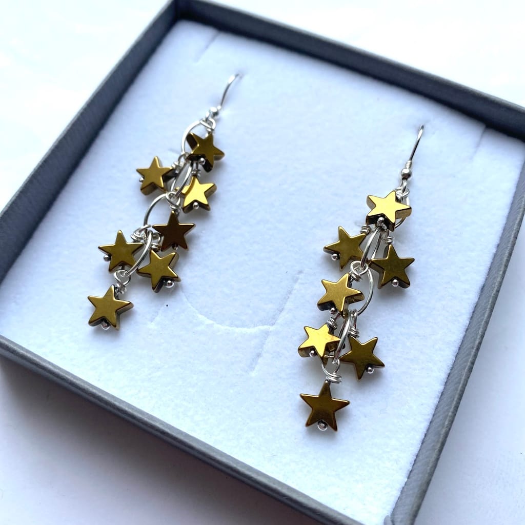 star waterfall earrings. 7 gold colour stars suspended on a link chain.