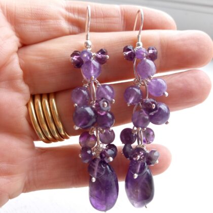 Cluster earrings made from purple amethyst stones which hang from a sterling silver chain and handmade hooks.