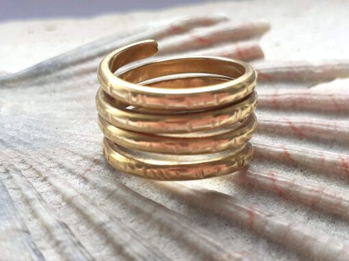 Textured gold spiral ring with 4 rotations.
