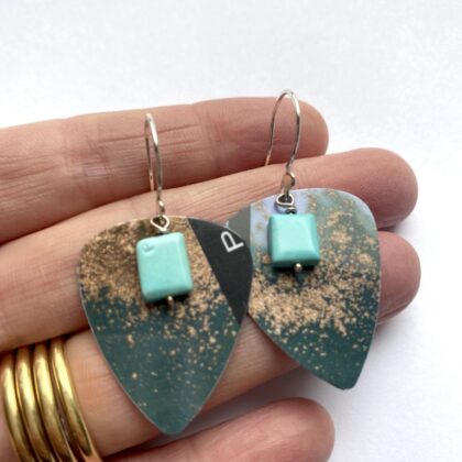 Blue guitar pick hook earrings with square turquoise gemstones.