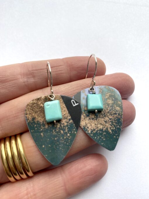 Blue guitar pick hook earrings with square turquoise gemstones.