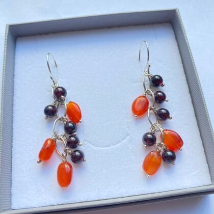 Earrings with carnelian and garnet stones on recycled silver.