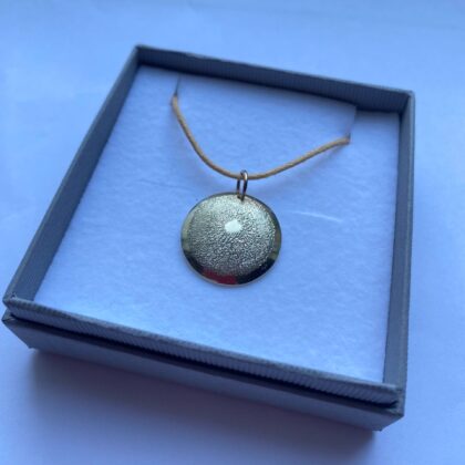 9ct gold disc pendant, slightly domed, hand engraved