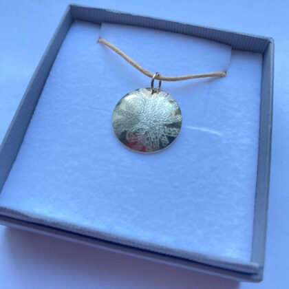 9ct gold disc pendant with fossil design engraved